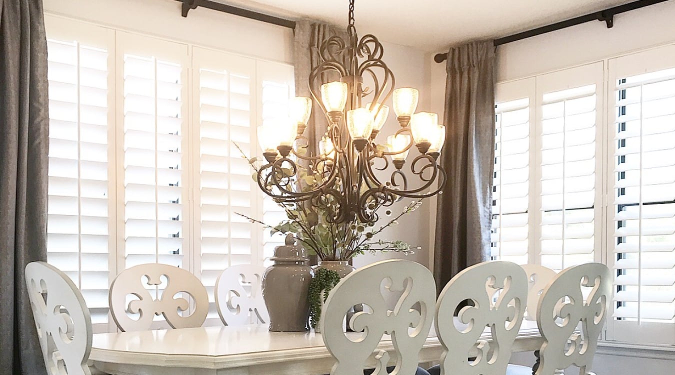Plantation shutters paired with curtains